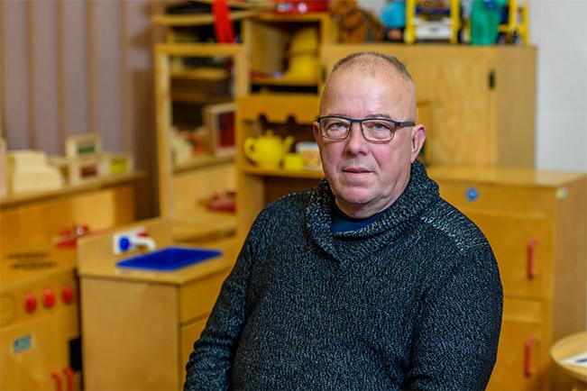 Stephen Breen poses in the Early Childhood Education classroom